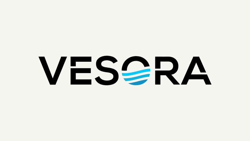 Logo of Vesora with the name in bold letters and a blue wave symbol.