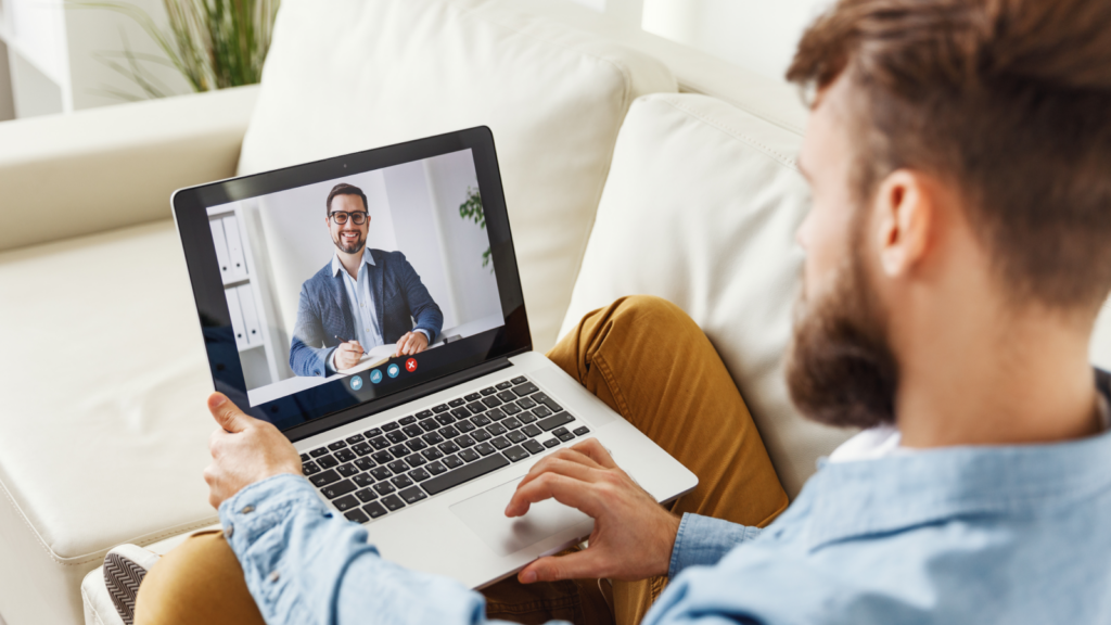 A man consulting online using a laptop.