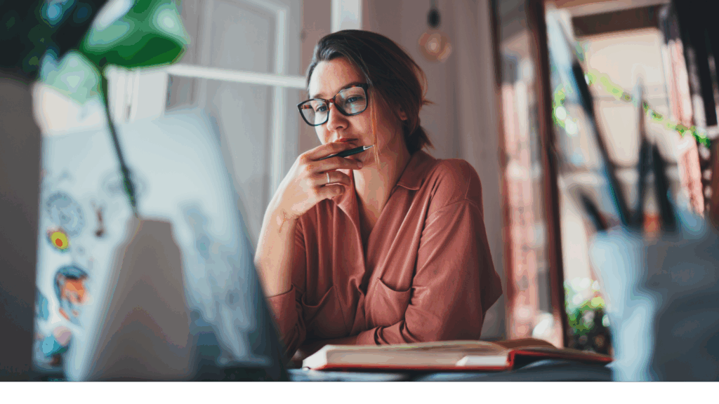 A woman working on a laptop.
