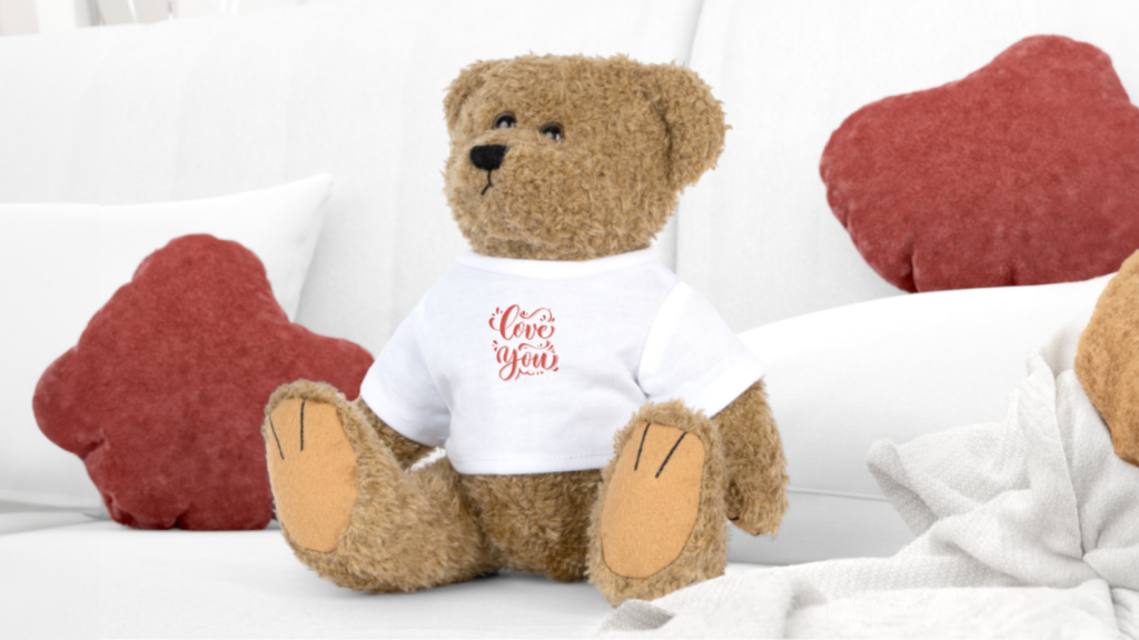 A custom toy bear wearing a white “Love you” tee as an example of a trending product to sell online.