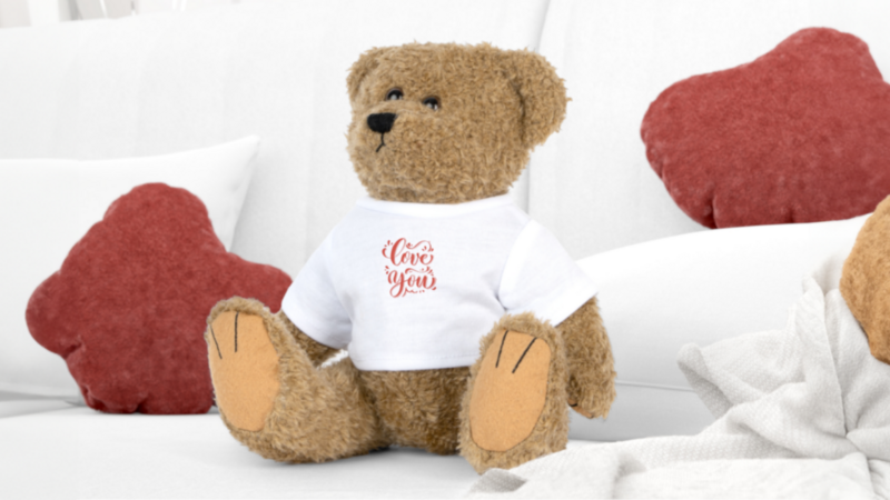 A custom toy bear wearing a white “Love you” tee as an example of a trending product to sell online.
