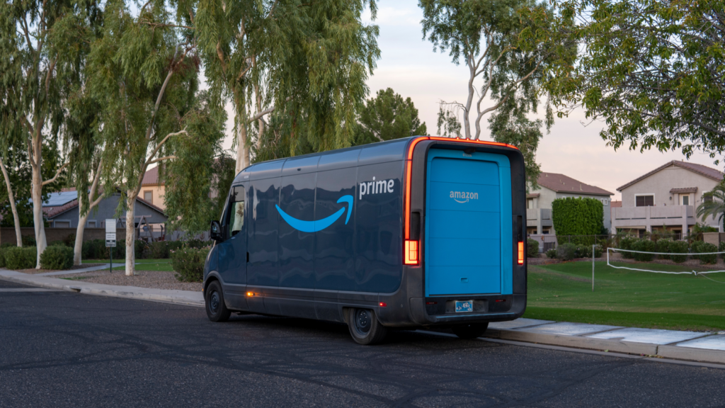 An Amazon delivery van standing in front of a house.
