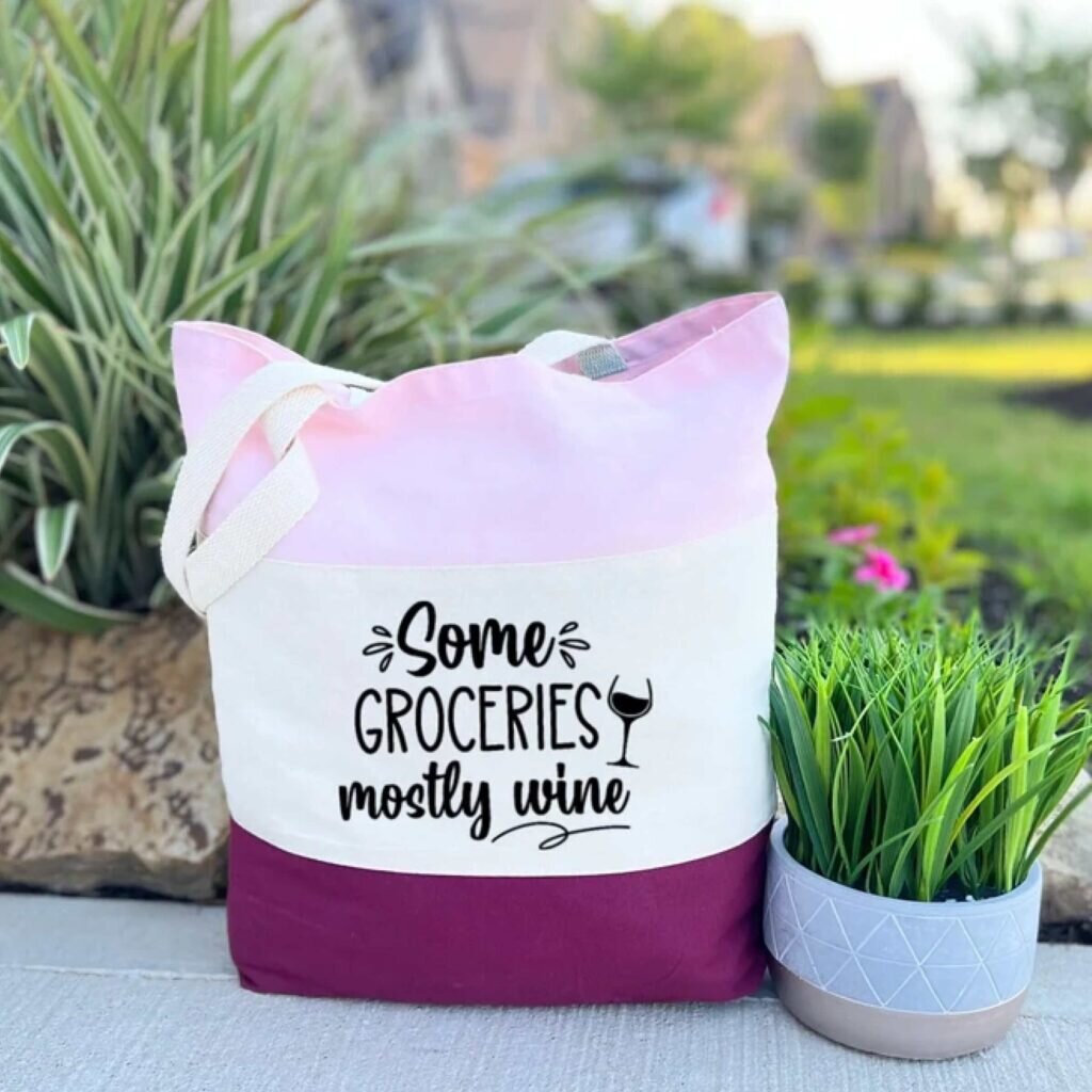 A grocery tote bag that says, “Some groceries, mostly wine.”