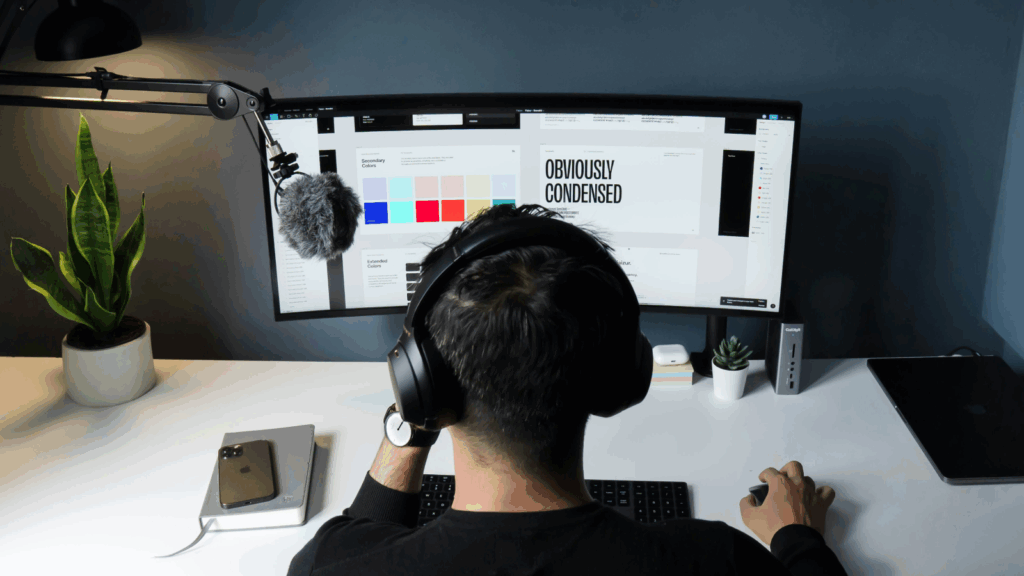 A man is using a computer to edit graphic design files.