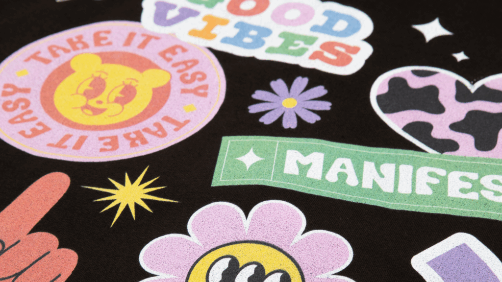 Various illustrations printed on a black t-shirt.