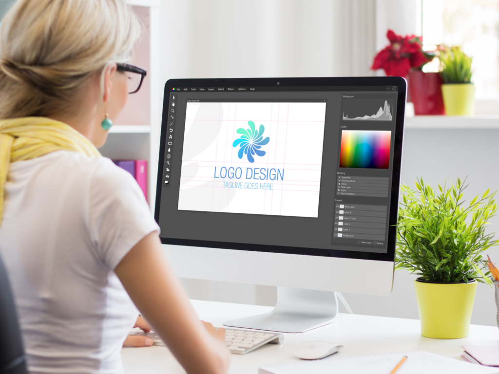Woman designing her own t-shirt logo in Photoshop.