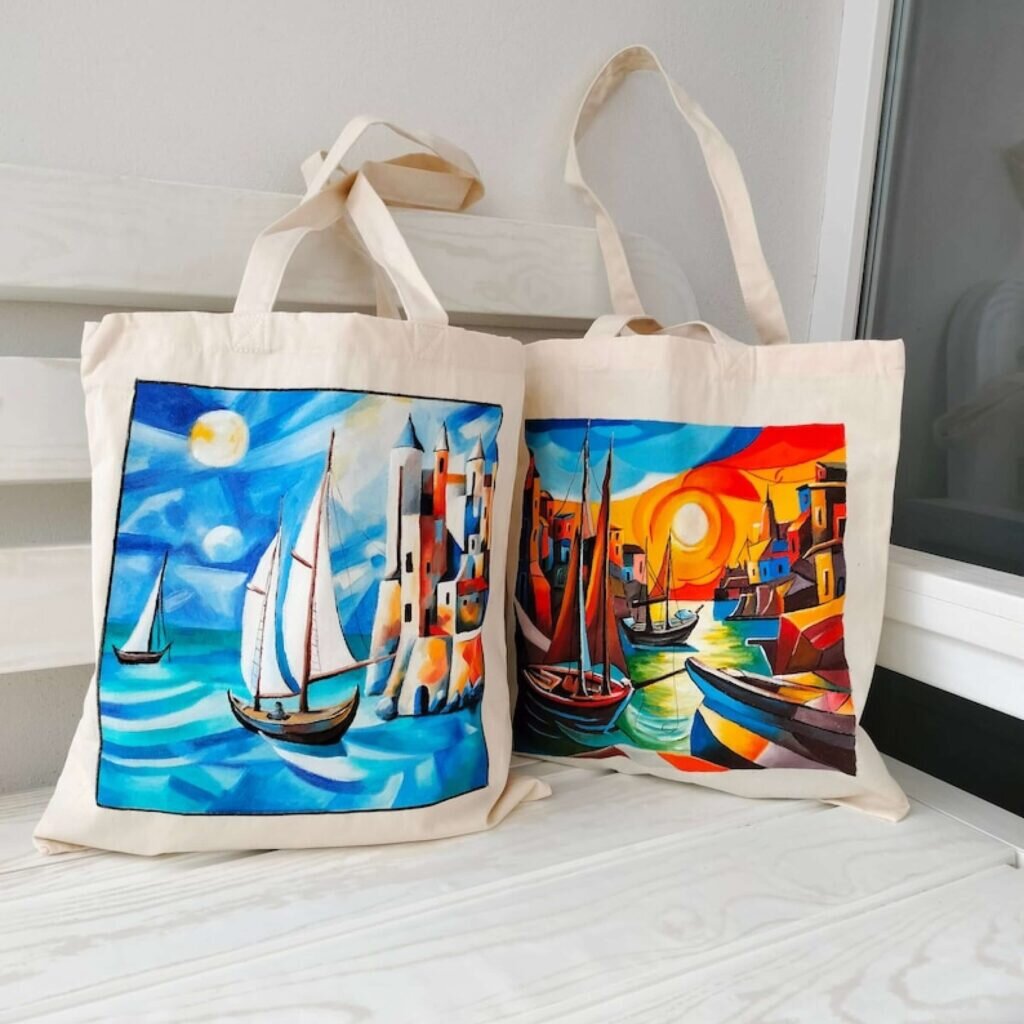 Tote bags with stylized mosaic-like artwork designs.