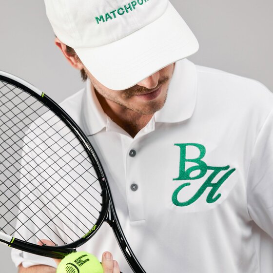 Custom embroidered team polo shirt with tennis racket