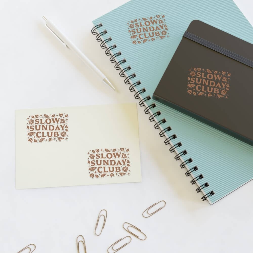 Stationery items with stickers on them, sticker sheet next to them.