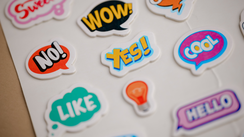 A collection of colorful speech bubble stickers with various expressions such as "WOW!", "YES!", "NO!", "LIKE", "COOL", and "HELLO".