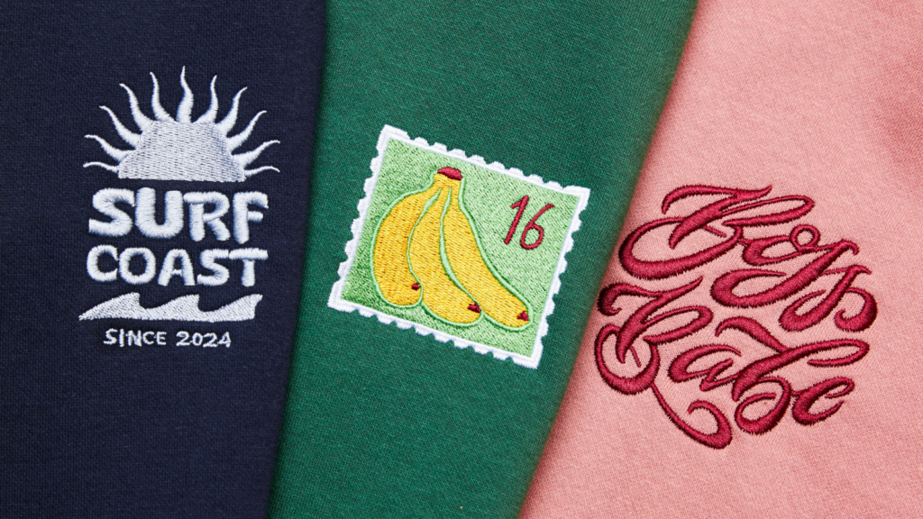 A navy patch with a sun and "Surf Coast Since 2024," a green patch with a banana stamp and "16," and a pink patch with "Boss Babe".