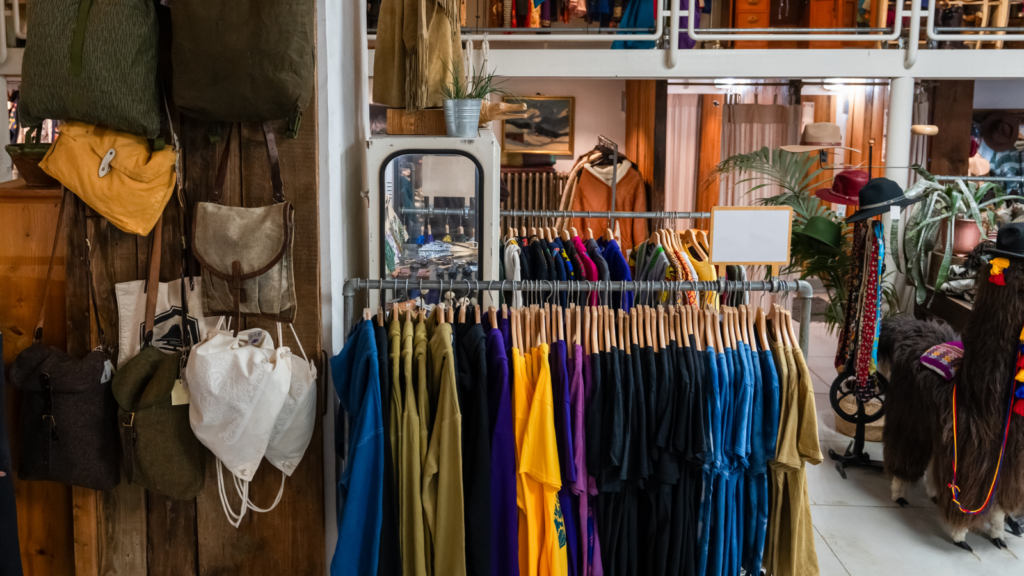 A thrift shop with various vintage clothing items.