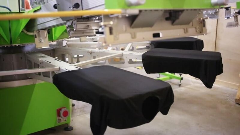 An industrial clothing printer to perform screen printing for apparel.