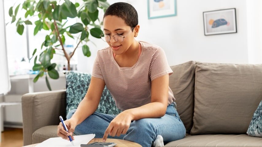A woman working on her eCommerce shipping strategy.