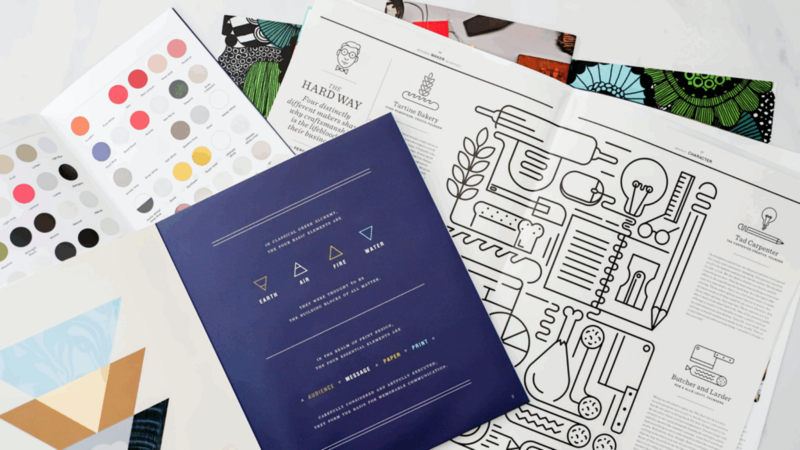 A book featuring a variety of colored papers and unique designs throughout its pages.