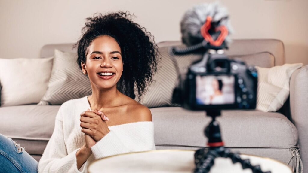 A young influencer looking into her camera.