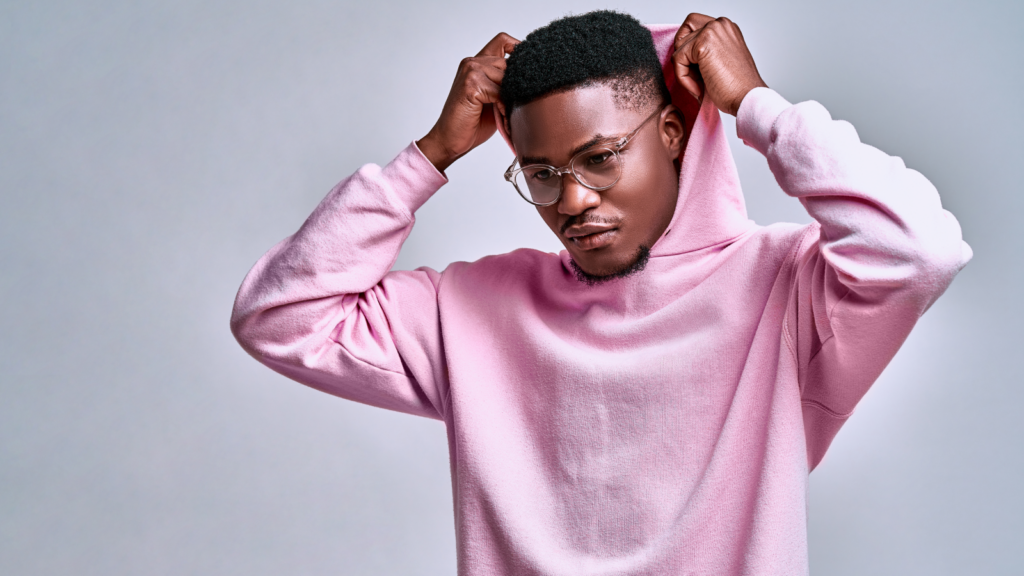 A man in a pink hoodie.