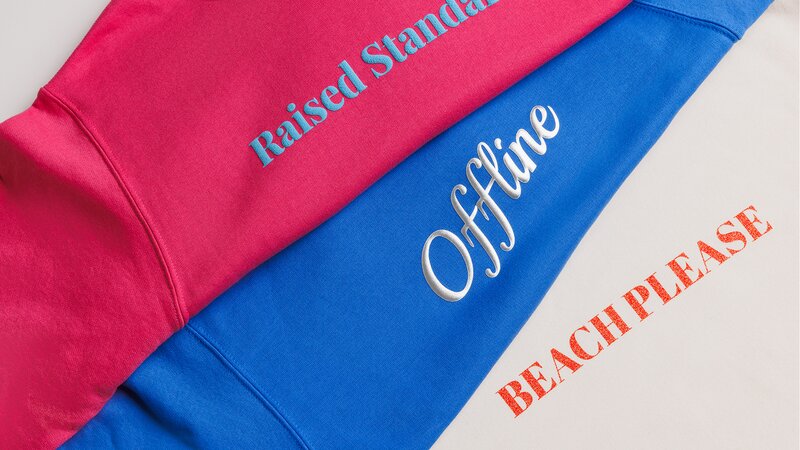 Bold sans-serif fonts that hold up across puff, metallic, and glitter prints