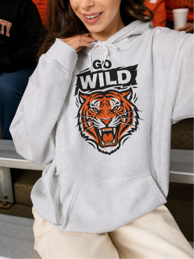 Boy wearing a colorful Field Day t-shirt outdoors