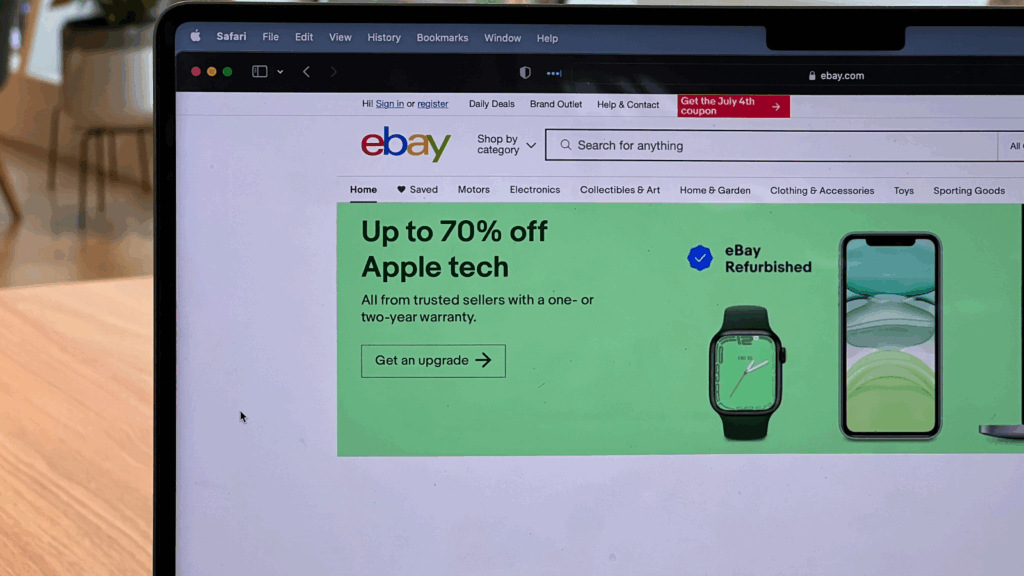 A laptop with ebay website turned on.