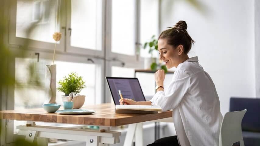 A woman learning how to use packaging inserts for her print-on-demand orders.