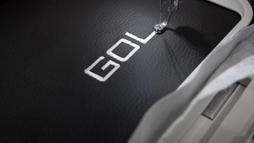 A picture showcasing the making of an embroidery logo.