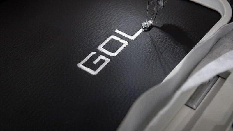 A picture showcasing the making of an embroidery logo.