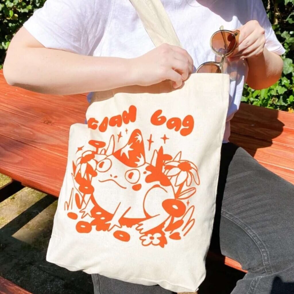 A tote bag with an image of a toad and the text “Toad bag.”