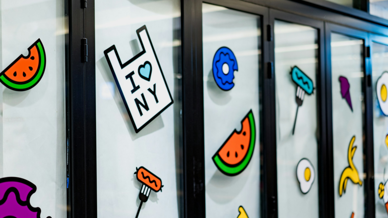 Windows covered in colorful stickers, creating a lively and cheerful atmosphere.