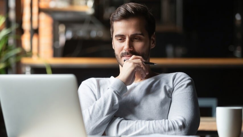 A man trying to figure out how to improve SEO on Amazon.