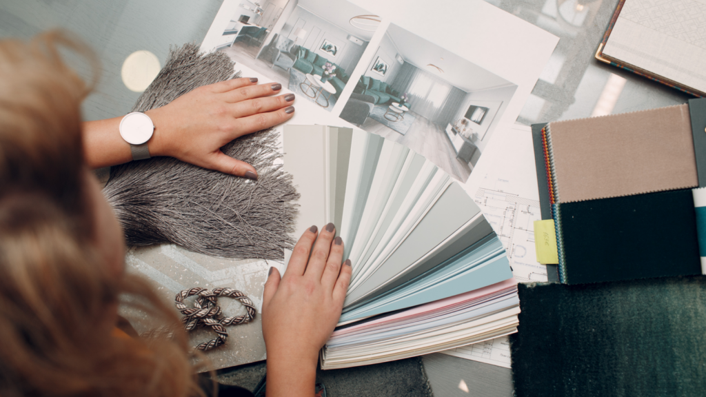An interior designer picks a color palette for the room design.