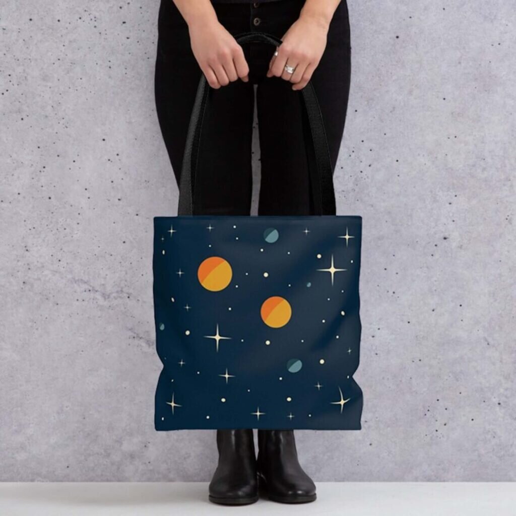 A tote bag with an outer space design.