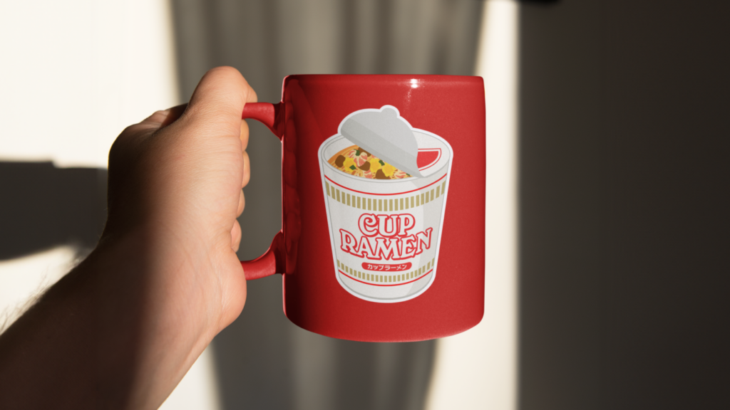 A red mug with a custom print of a ramen cup.