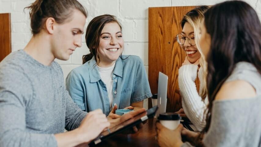 A group of people talking and laughing.