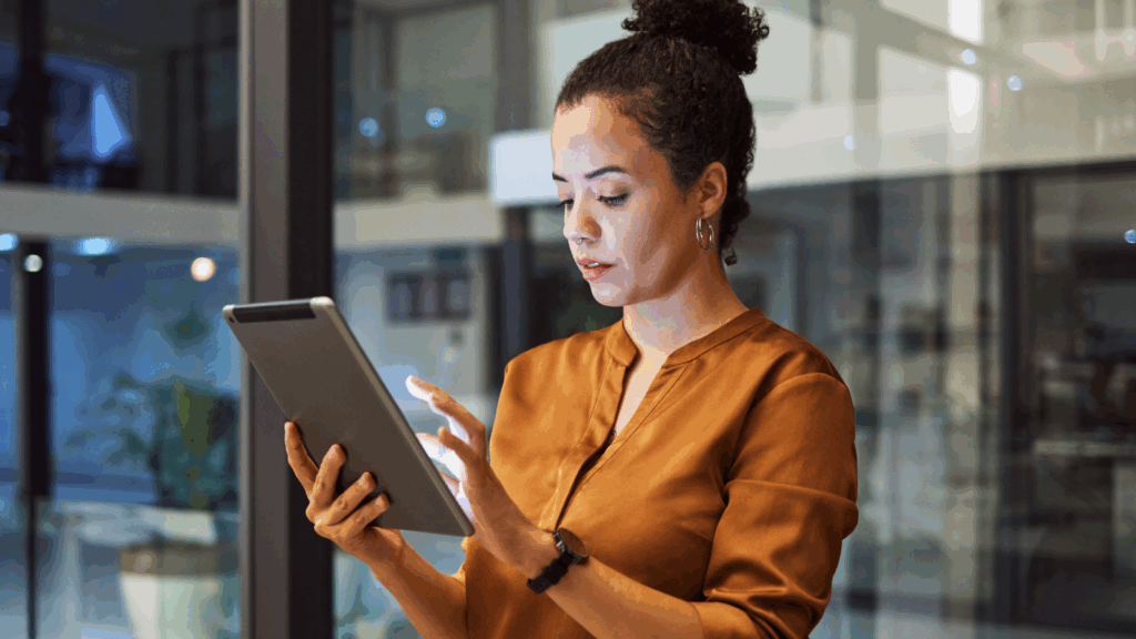 A woman is doing research on her tablet.