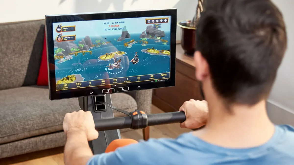Aviron workout library game playing on the rower touchscreen during a home workout
