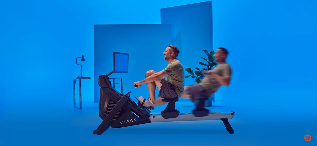 Motion blur of the rowing stroke on an Aviron Strong Rower, showing the speed of goal-split interval training
