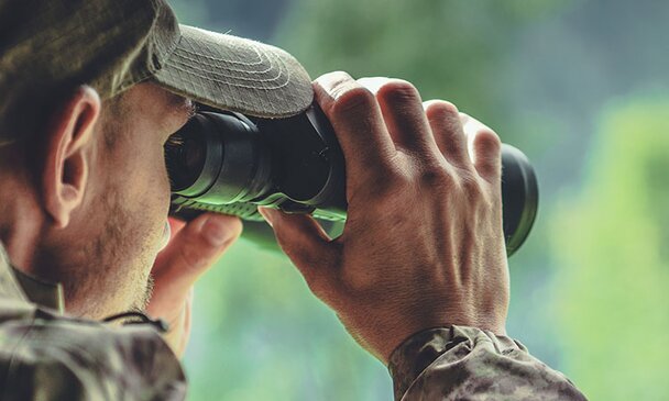 Man using telescope