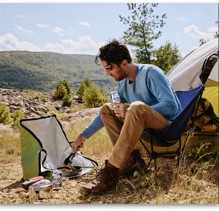 Camper using Busch Light Solar Cooker