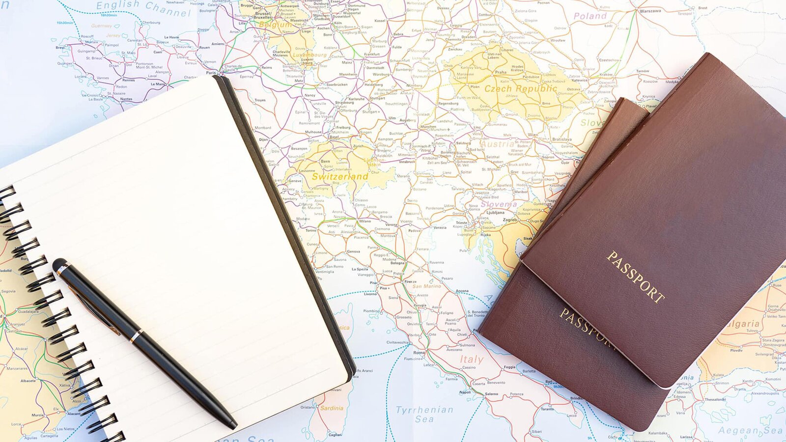 Photo of a map and a passport
