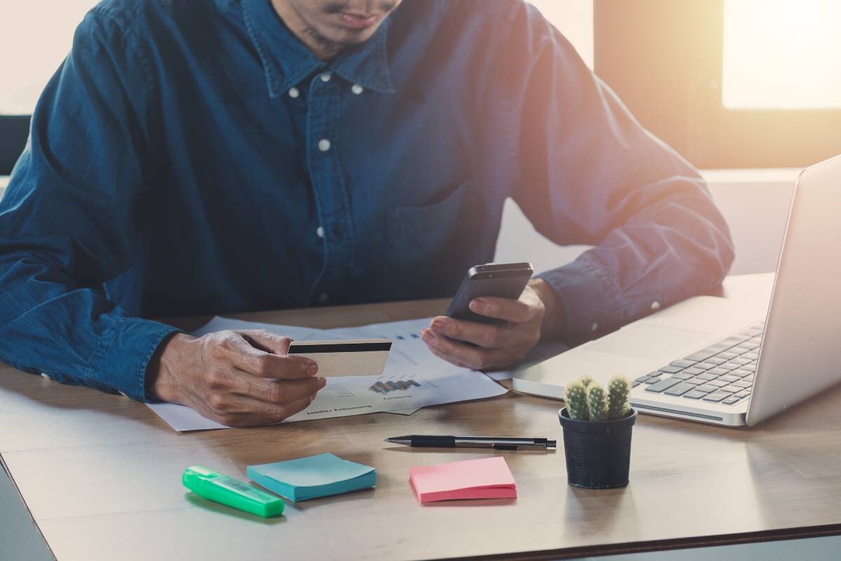 Man with his phone checking his accounts