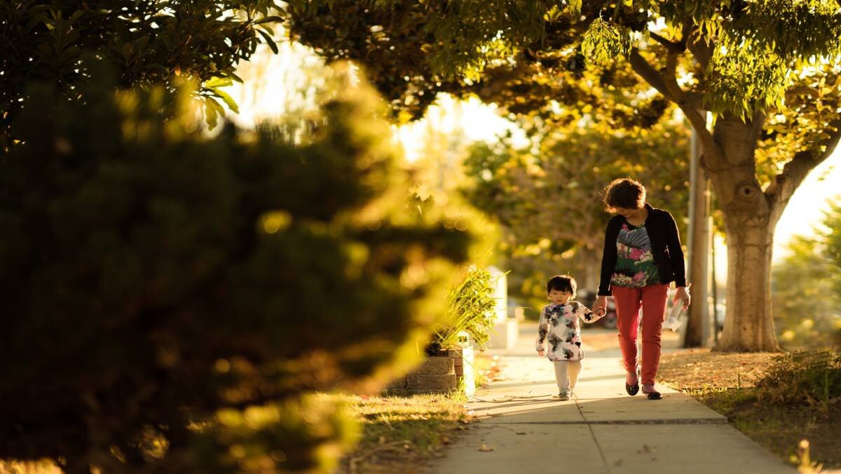 Mother walking with her little girl