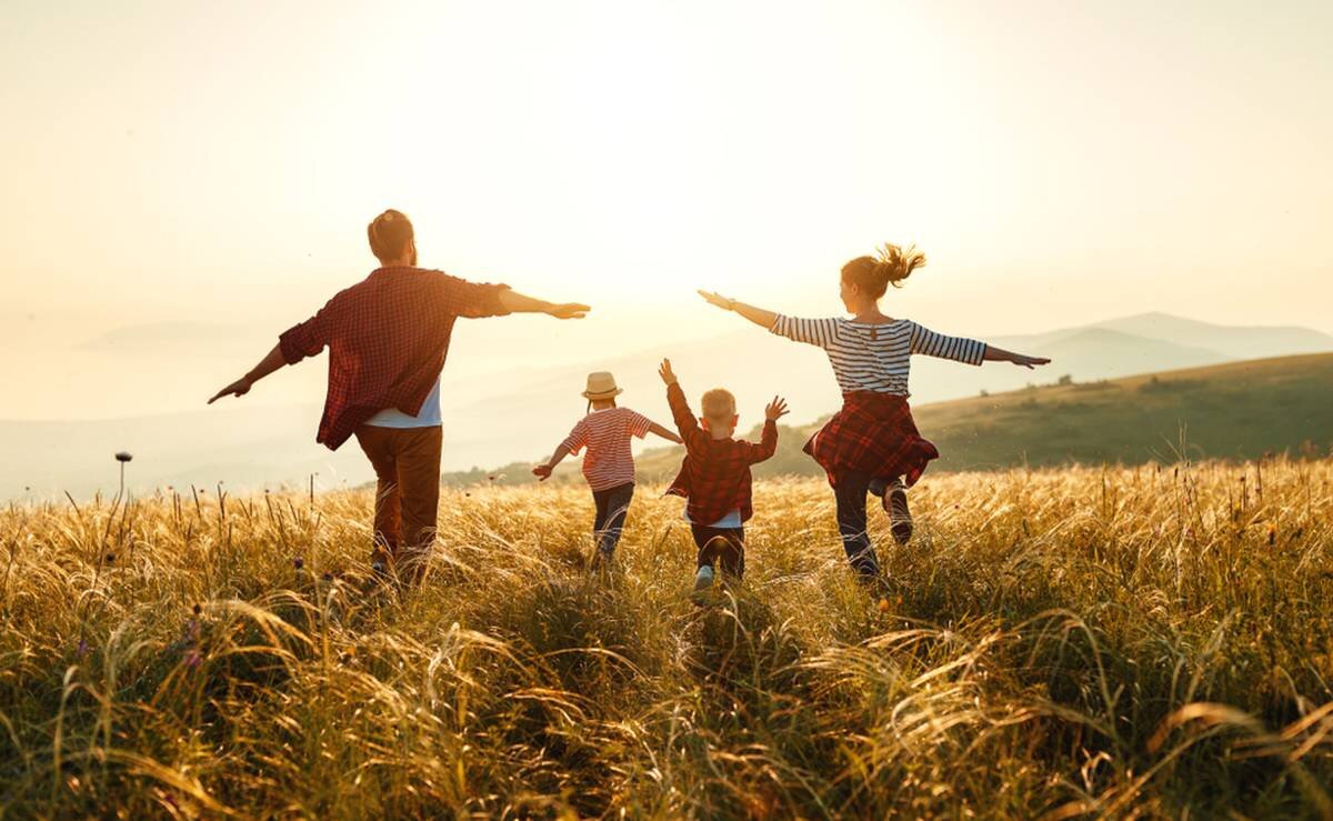 Family enjoying in the meadow