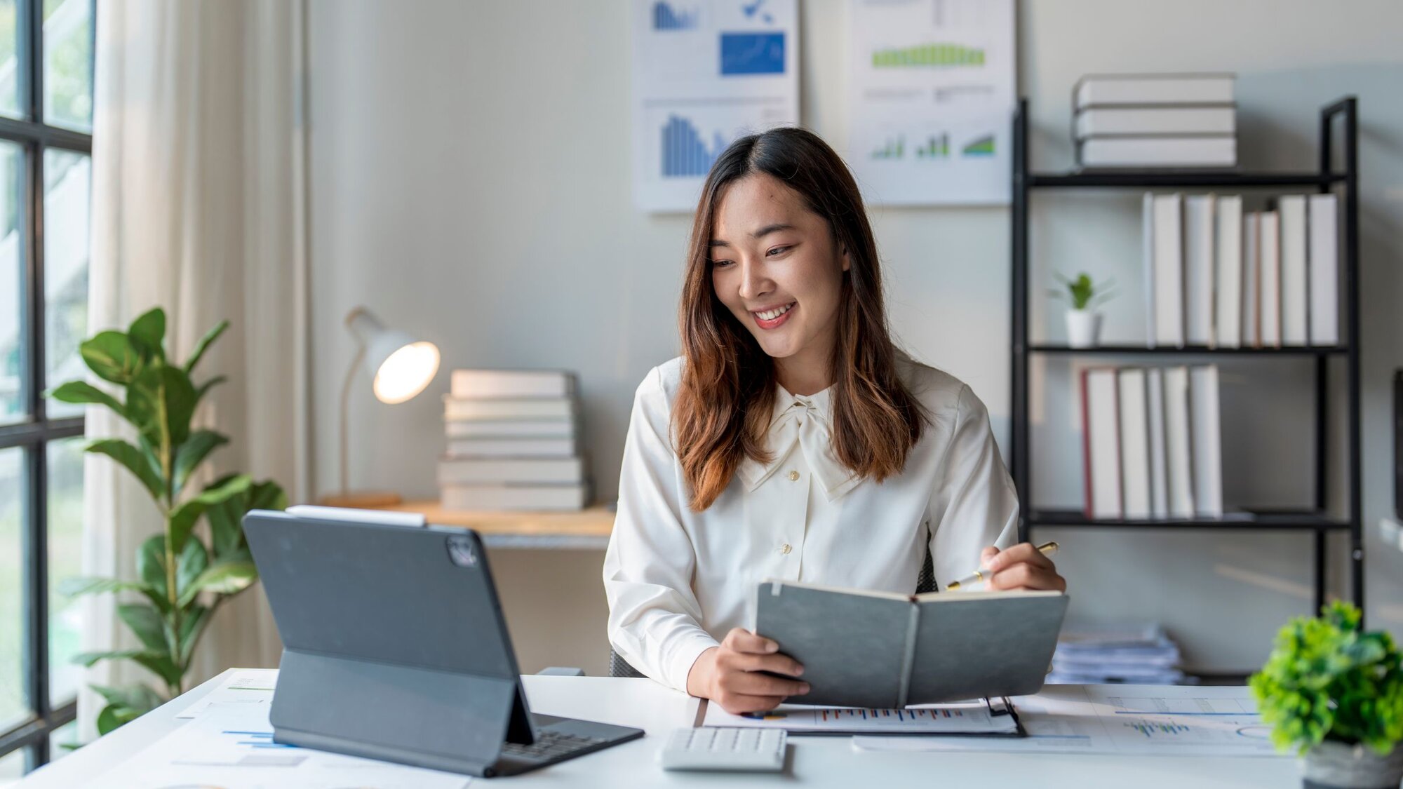 woman looking at laptop while making HSA reimbursements