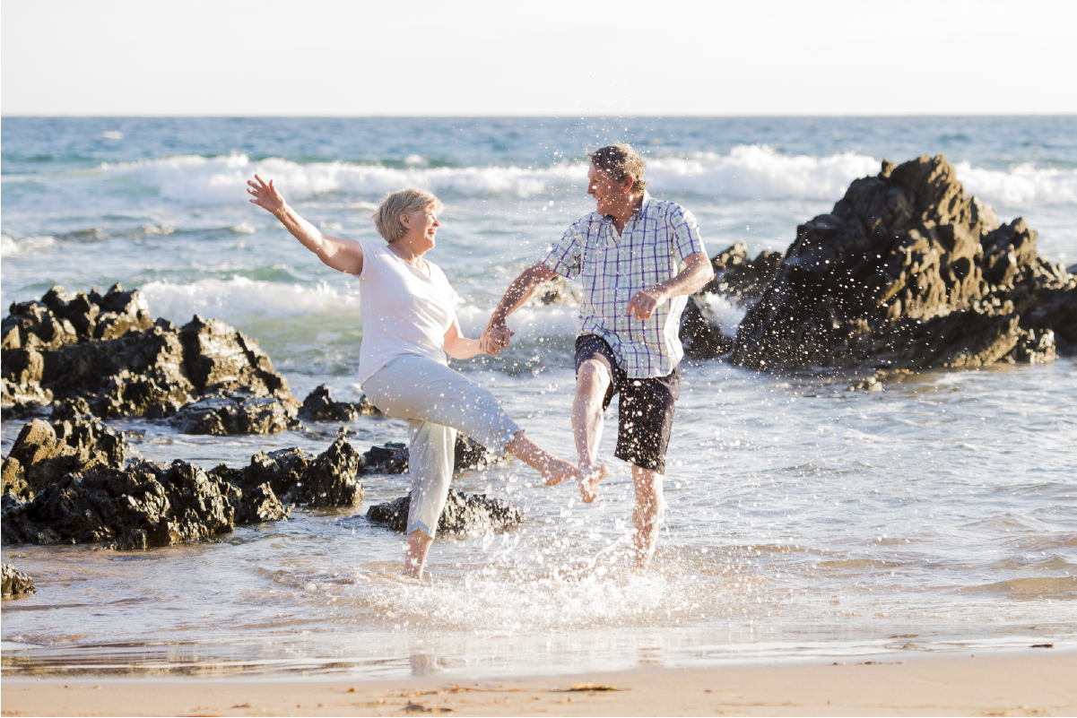 65 years old couple happy on beach