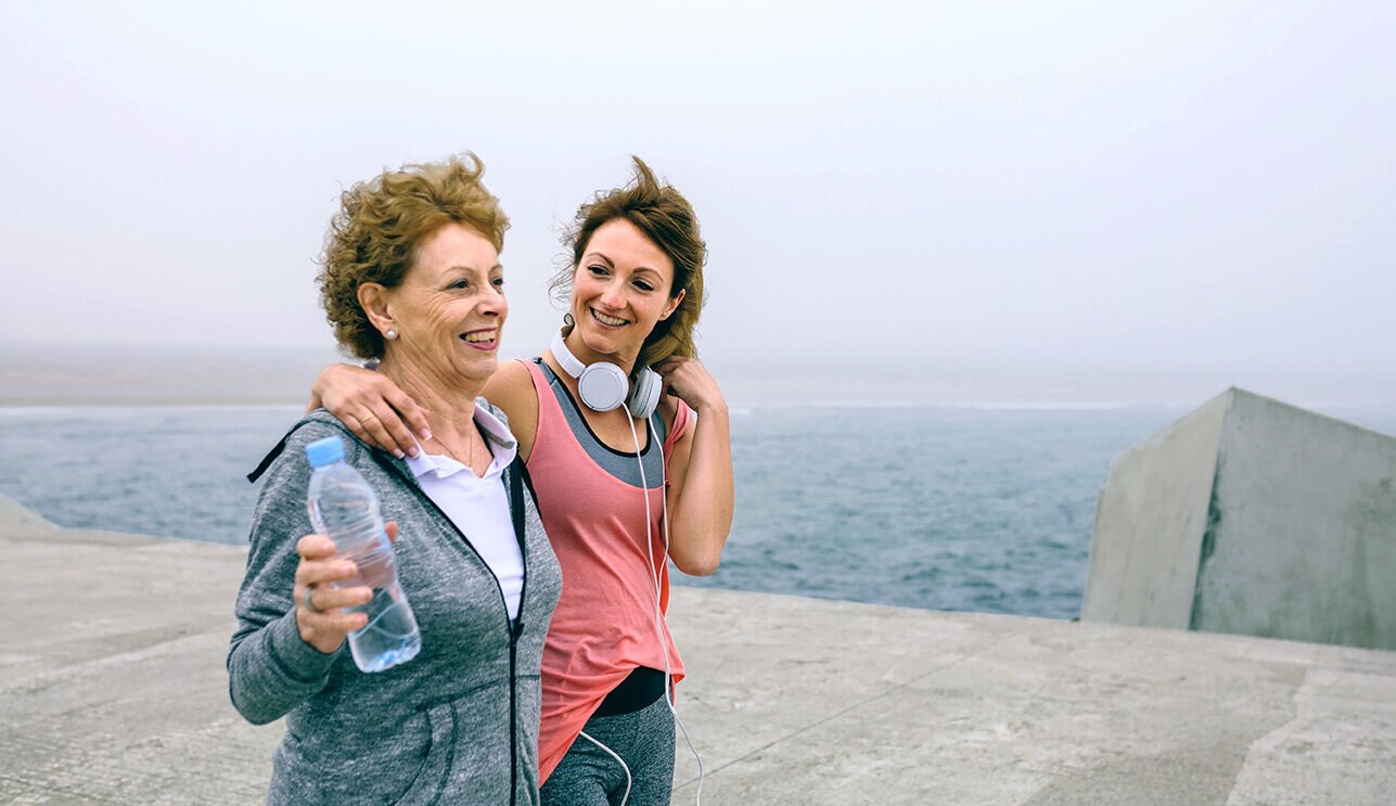 Female runners walking on the waterfront