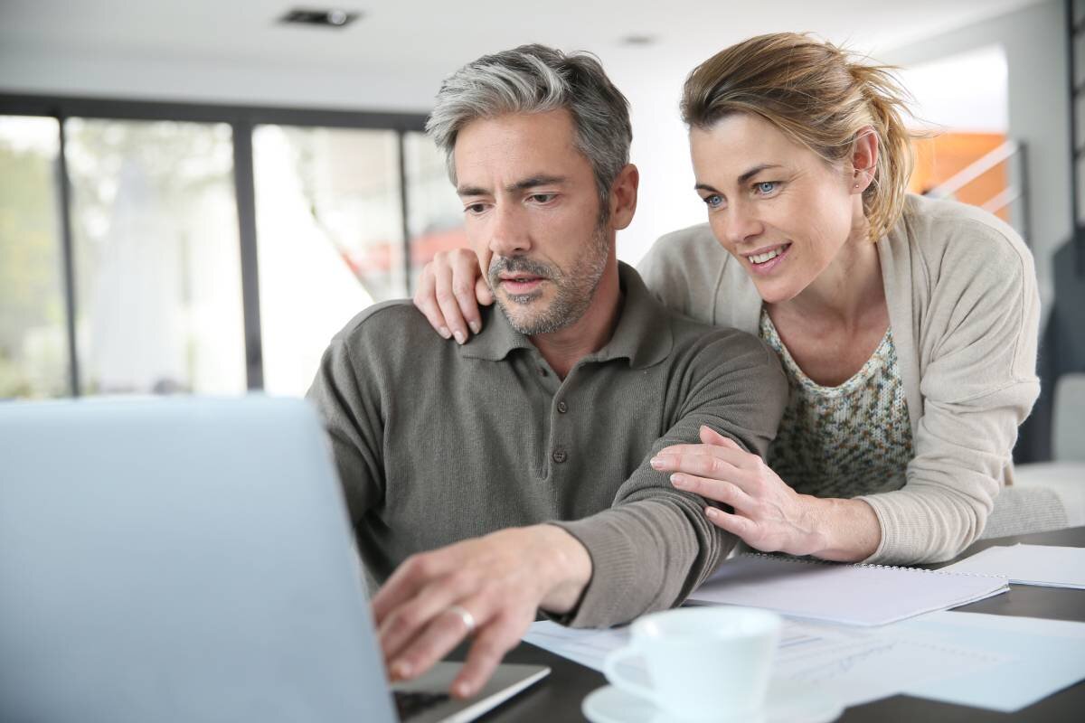 Couple looking at laptop screen