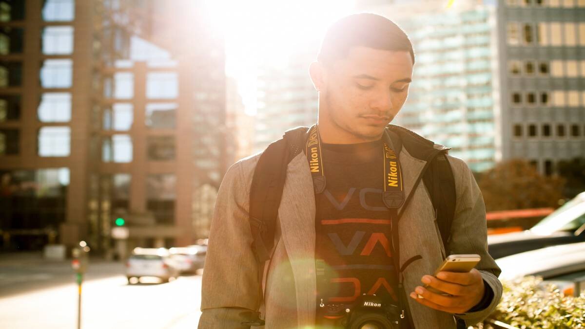 Boy checking his cell phone