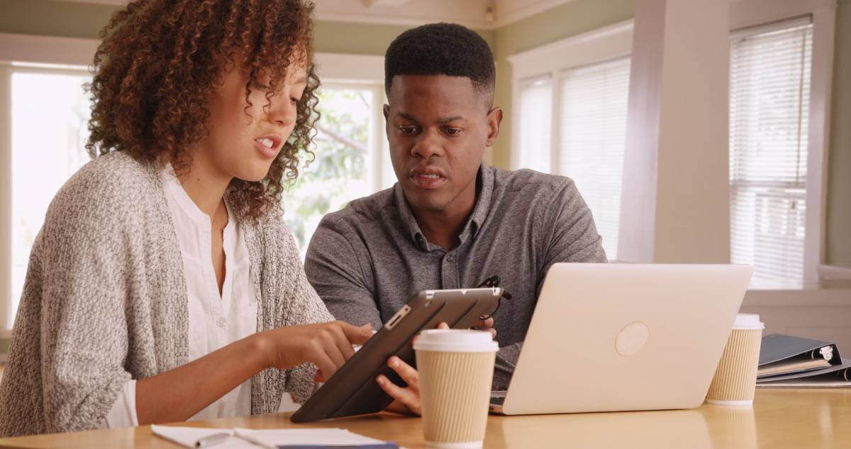 Couple reviewing deductions and fees