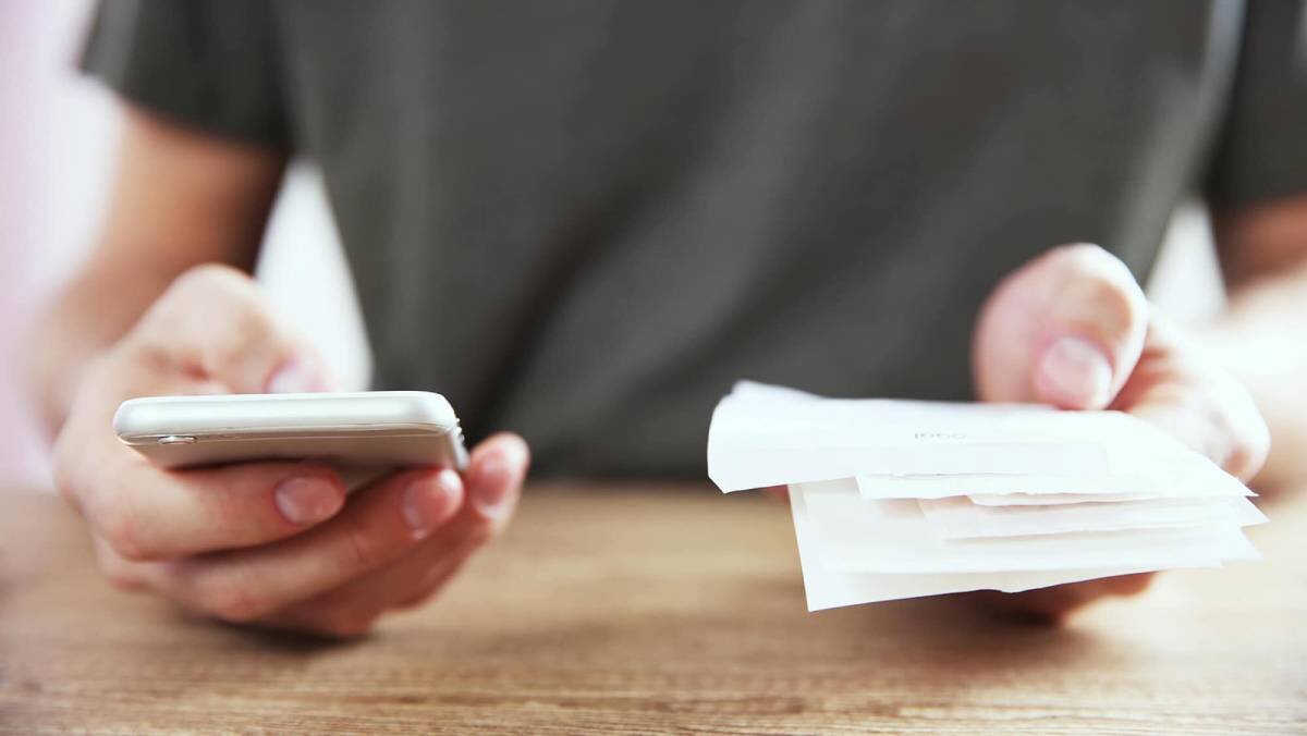 Person looking through their receipts